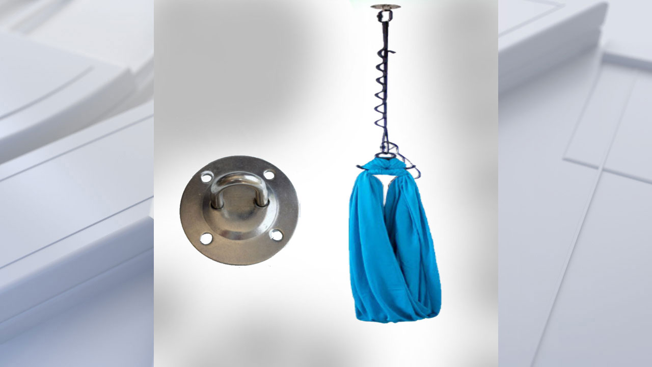 A child enjoying a ceiling swing in a safe environment